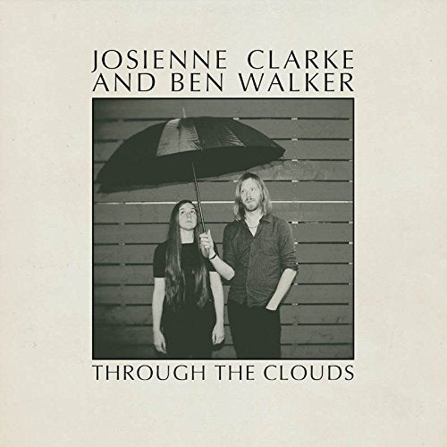 Black and white album cover featuring a couple with an umbrella.