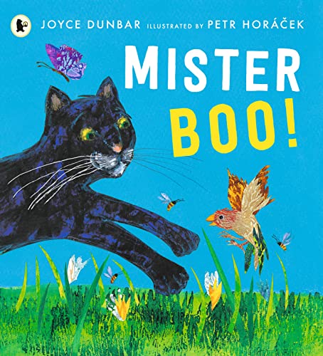 A black cat leaps toward a small bird in a grassy field with butterflies.