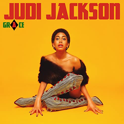 Judi Jackson album cover: woman in striped pants and fur against yellow.