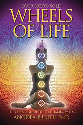 Book cover featuring a person in a yoga pose with seven glowing chakra symbols.