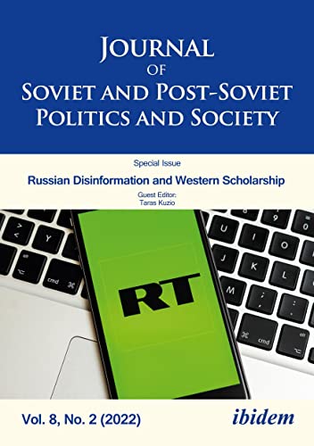 Journal cover with a smartphone displaying “RT” logo over a keyboard.