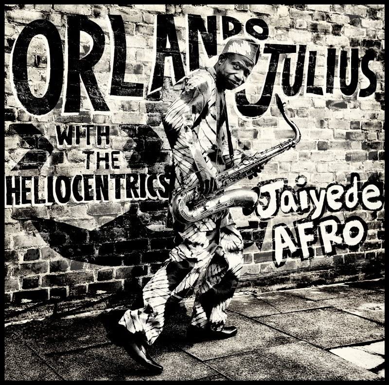 Album cover featuring a musician with a saxophone against a brick wall.
