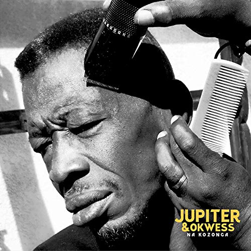 Black and white portrait of a man getting a haircut, album cover.