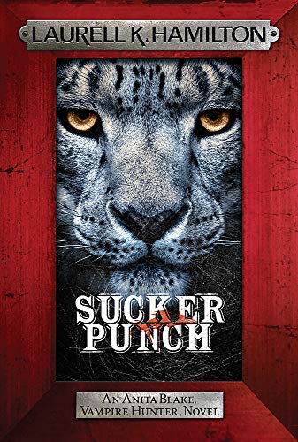 Book cover featuring a close-up of a snow leopard's face inside a red frame.