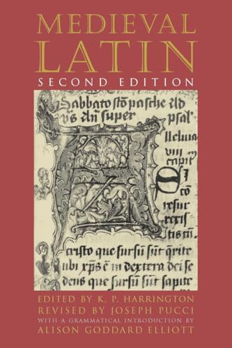 Red book cover with illuminated manuscript letter "S" and text.