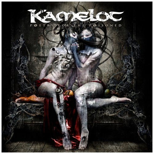 Kamelot album cover: two figures embrace amidst dark, ornate machinery.