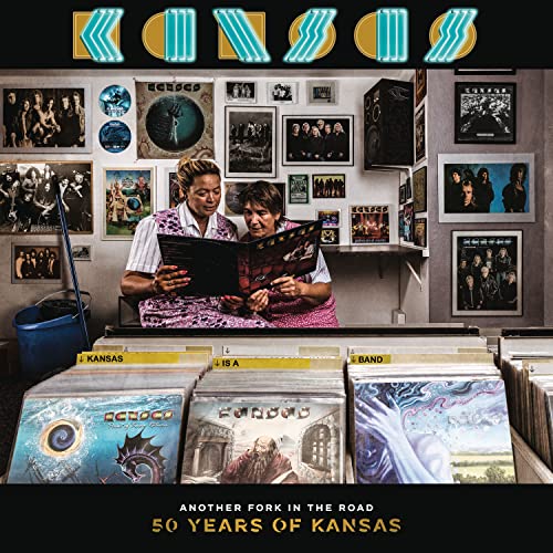 Kansas album cover: two women looking at records in a cluttered room.