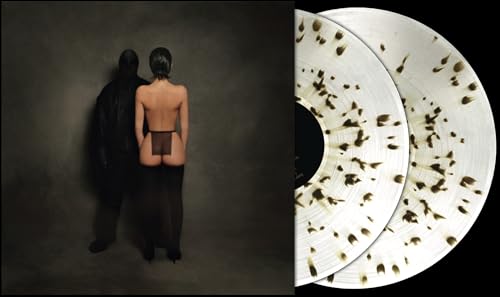 Vinyl record with gold splatter, album cover showing two figures.