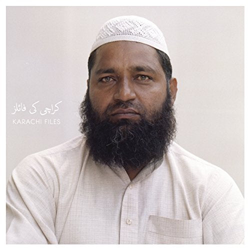 "Album cover featuring a man with a beard and white cap, against a plain background."