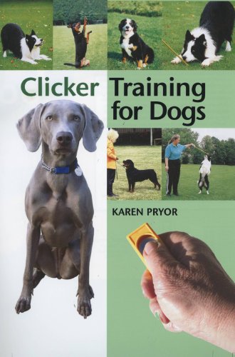 Book cover featuring dogs, a trainer, and a clicker for training.