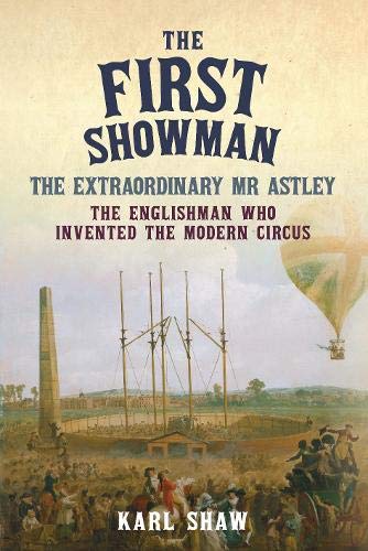 Book cover: "The First Showman" with a circus scene and hot air balloon.
