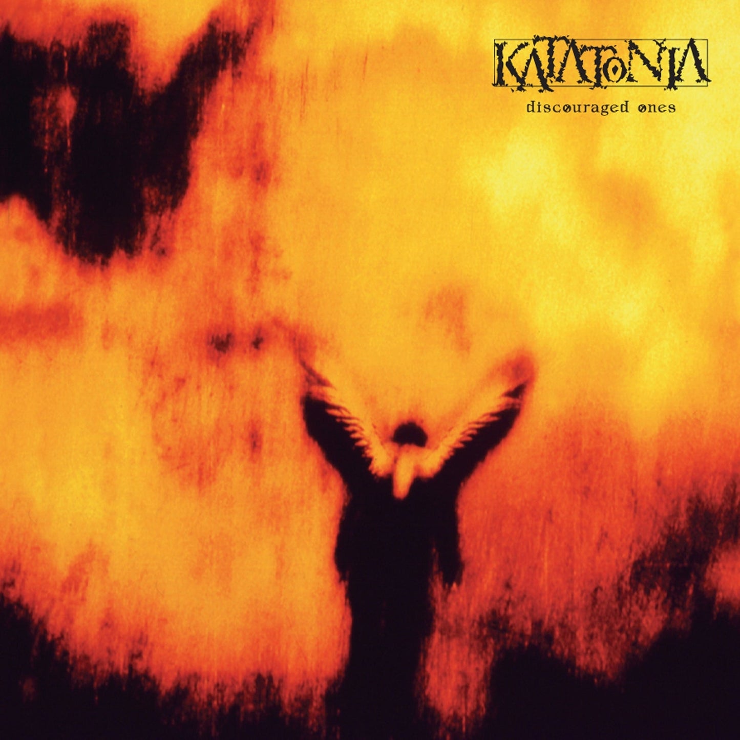 Album cover featuring a dark winged figure against a blurry orange and yellow background.