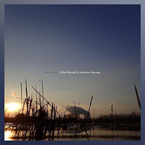 CD cover: landscape with reeds, sunset, and distant smoke plume.