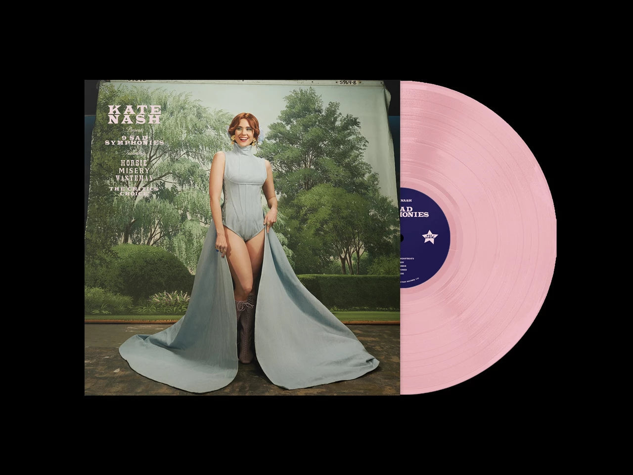 Kate Nash album cover featuring her in a blue dress next to pink vinyl.