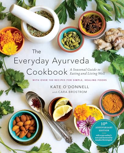Cookbook cover with spices, herbs, nuts, and citrus arranged around the title.