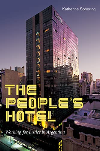 Book cover: tall building with illuminated windows and large title text.