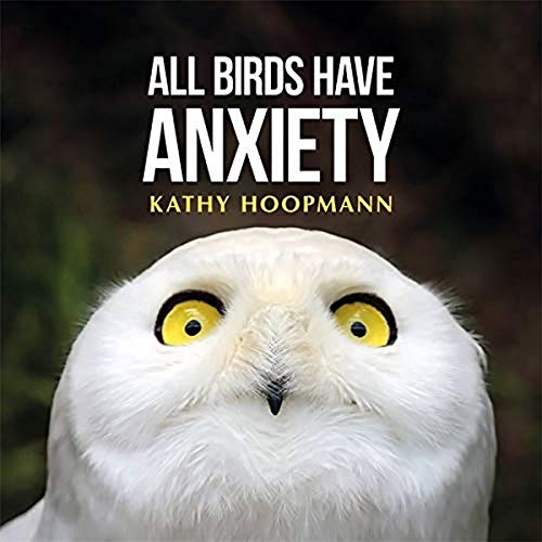 Book cover featuring a close-up of an owl’s face with large eyes.