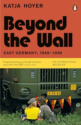 Book cover: “Beyond the Wall” with a military vehicle and people.