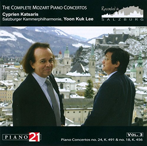 CD cover featuring two men in suits against a snowy Salzburg cityscape.