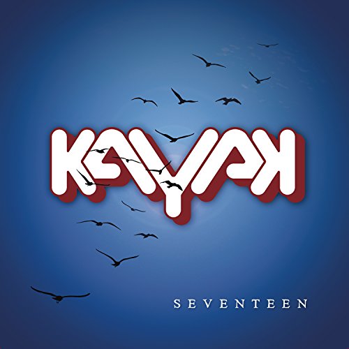 The image is a blue album cover for "Kayak - Seventeen" with white text and birds. An appropriate alt text for this image could be: "Blue album cover with 'Kayak' in white and red, 'Seventeen' below."