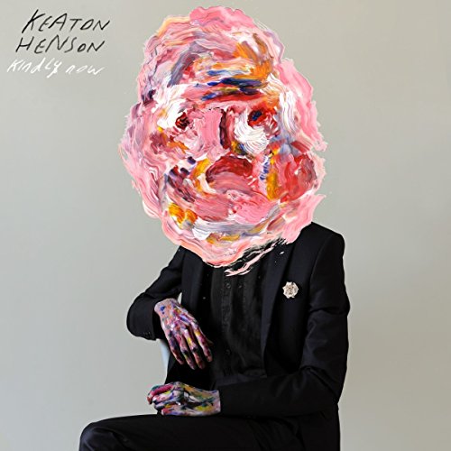 Man in suit with head obscured by thick, colorful pink paint.