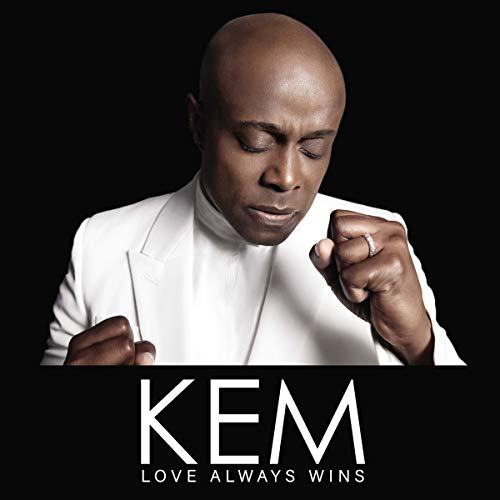 Close-up of Kem, a Black man in a white suit, with album title.