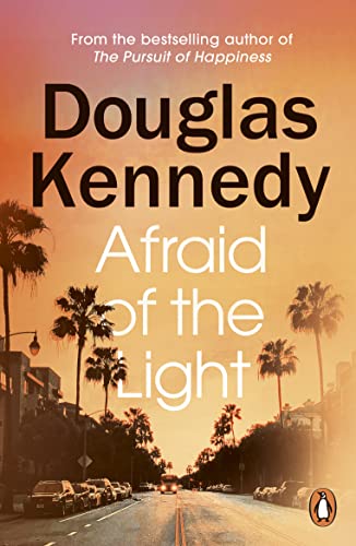Book cover with title and author text over a sunset street scene with palms.