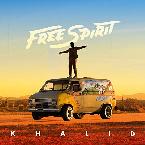 Man standing on top of a van under "Free Spirit" text by Khalid.