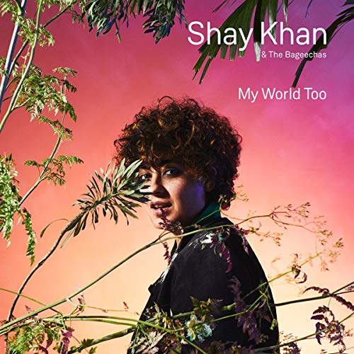 CD cover featuring a person with curly hair amidst foliage.
