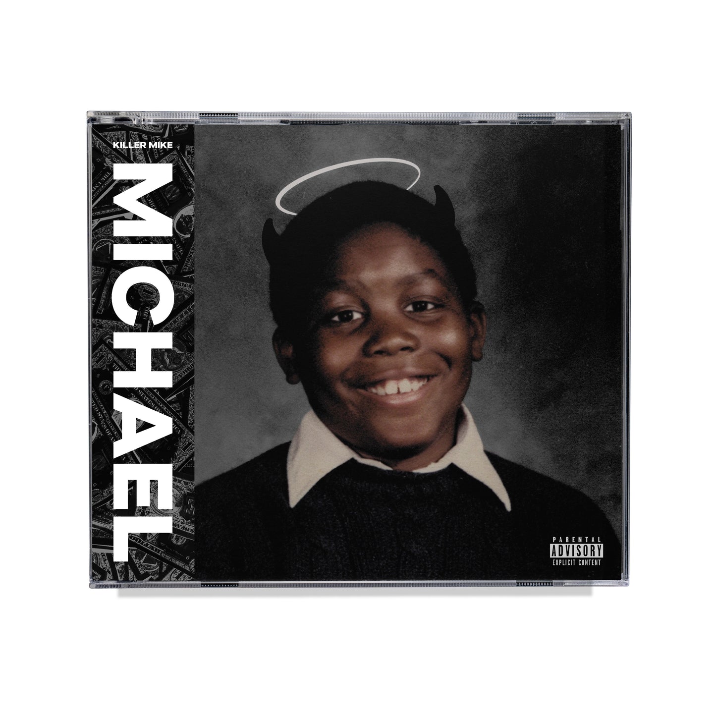 "CD case with a black-and-white portrait of a smiling boy with devil horns and halo."