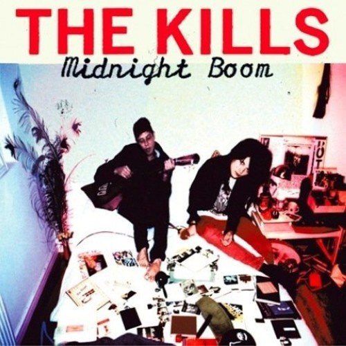 The Kills “Midnight Boom” CD cover with a couple in a messy room.