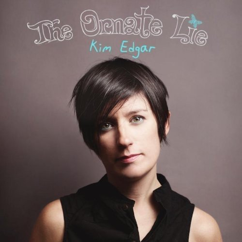 Kim Edgar album cover featuring a woman with short dark hair against a grey background.