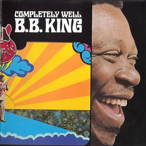 B.B. King album cover: portrait, guitar, colorful sunburst design.