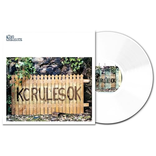Vinyl record with album cover showing a weathered wooden fence and text.