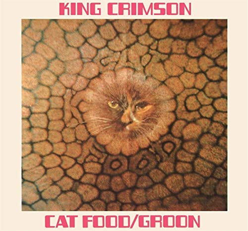 Brown cat's face on a brown background with black lines, pink text on beige border.