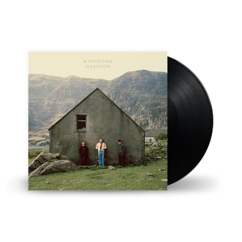 Vinyl record and album cover featuring a building with three figures.