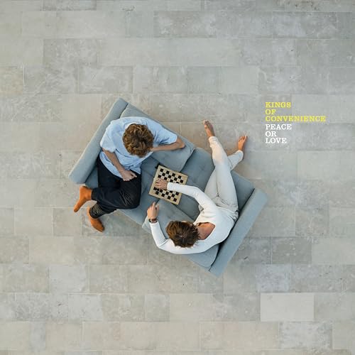Album cover: two men lounging on a sofa playing chess.