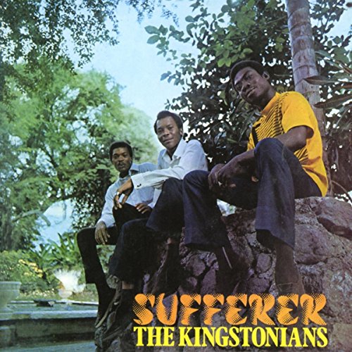 Three men sit on a stone wall in a park, with album text below them.