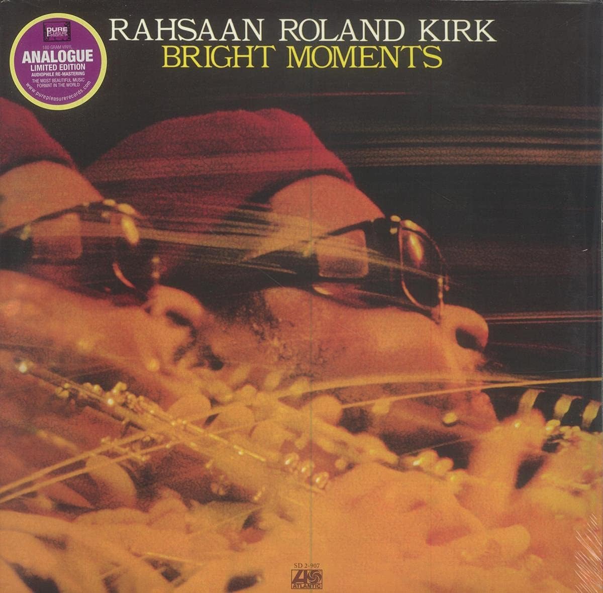 Record album cover featuring Rahsaan Roland Kirk in sunglasses playing multiple instruments.