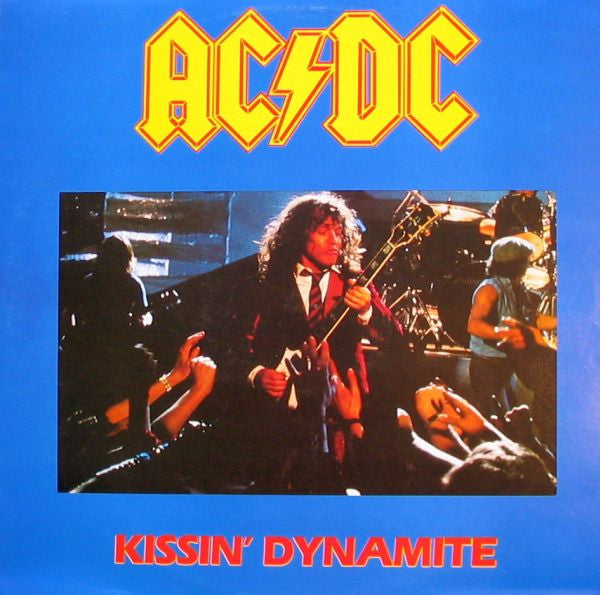 AC/DC “Kissin’ Dynamite” vinyl album cover with band performing live.