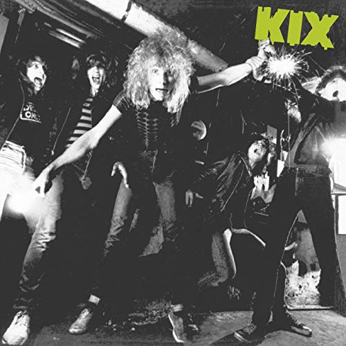 Black and white photo of the band Kix posing with sparklers.