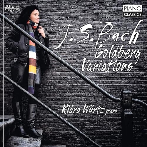 Record cover featuring pianist Klara Wurtz beside a dark brick staircase.