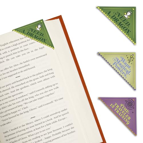 Four corner bookmarks with whimsical designs rest on an open book.