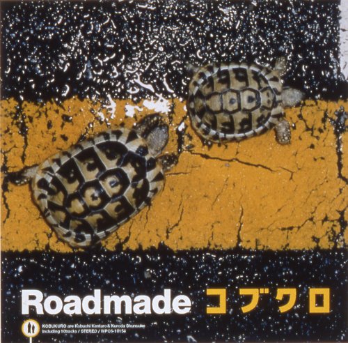 CD cover: two tortoises on a cracked yellow and black road.