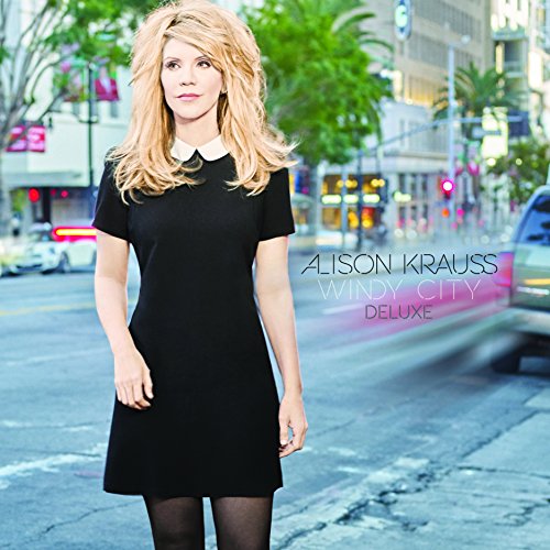 Alison Krauss album cover, woman in black dress on city street.