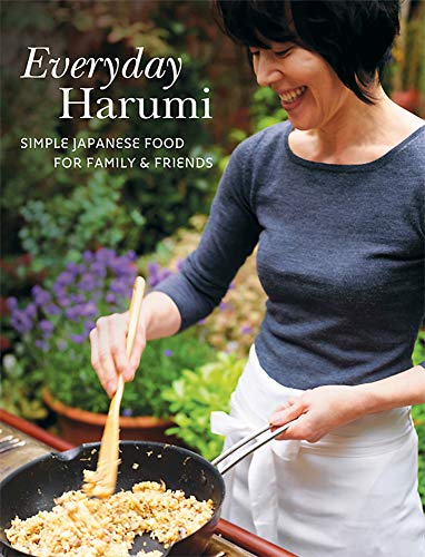 Cookbook cover featuring a smiling woman cooking in a pan outdoors.