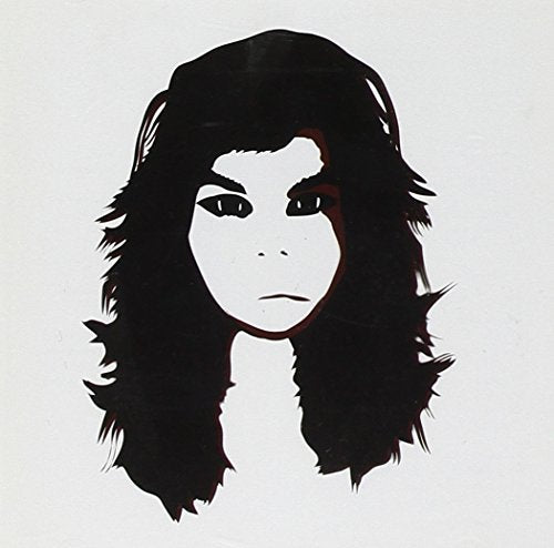 Black and white portrait of a person with long dark hair.