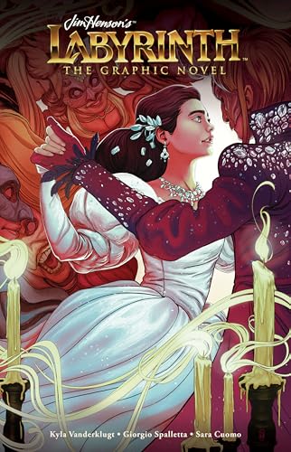 Sarah and Jareth dancing in a ballroom surrounded by masquerade guests and lit candles.