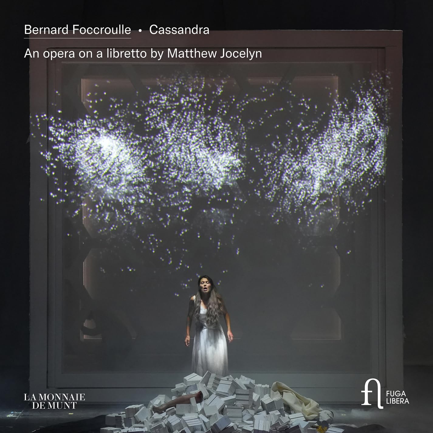 CD cover: opera scene with a singer amidst debris and light.