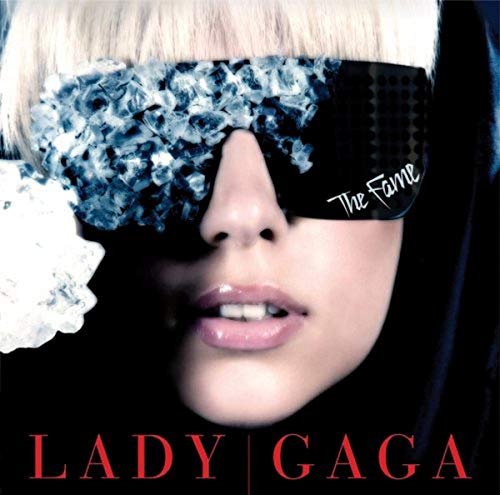 Lady Gaga album cover, “The Fame,” featuring a close-up of her face with sunglasses.